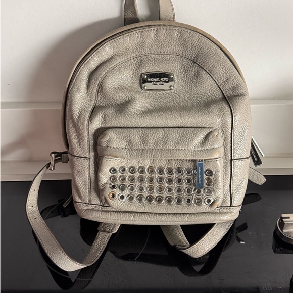 Michael Kors Handbags - Michael Kors Beige Studded Backpack